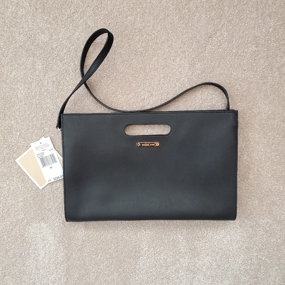 Michael Kors Handbags - Pre-owned Michael Kors Clutch Black Leather